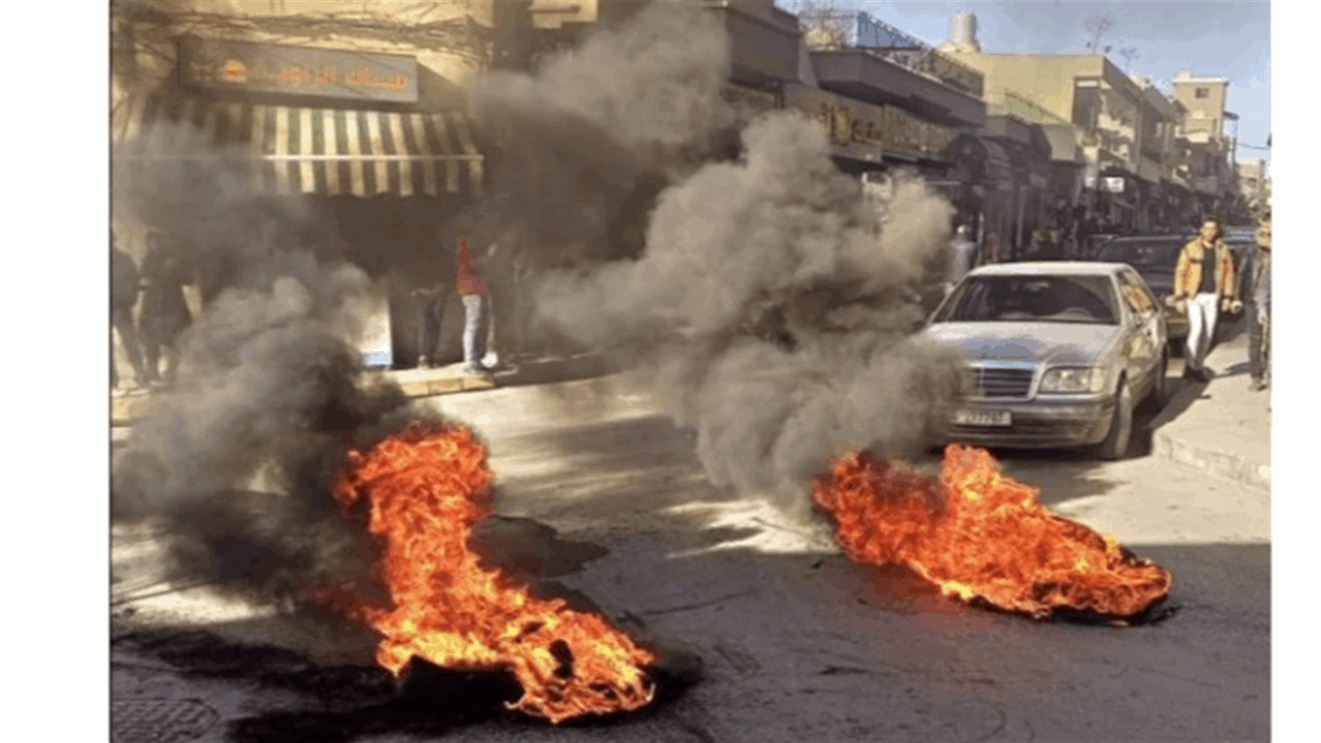 Protesters block the road in Baalbek’s commercial market
