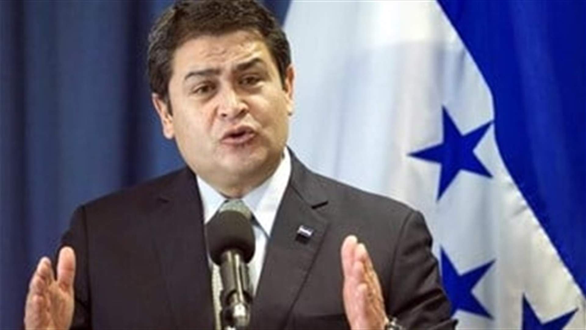 Honduran police surround house of ex-president after U.S. seeks extradition