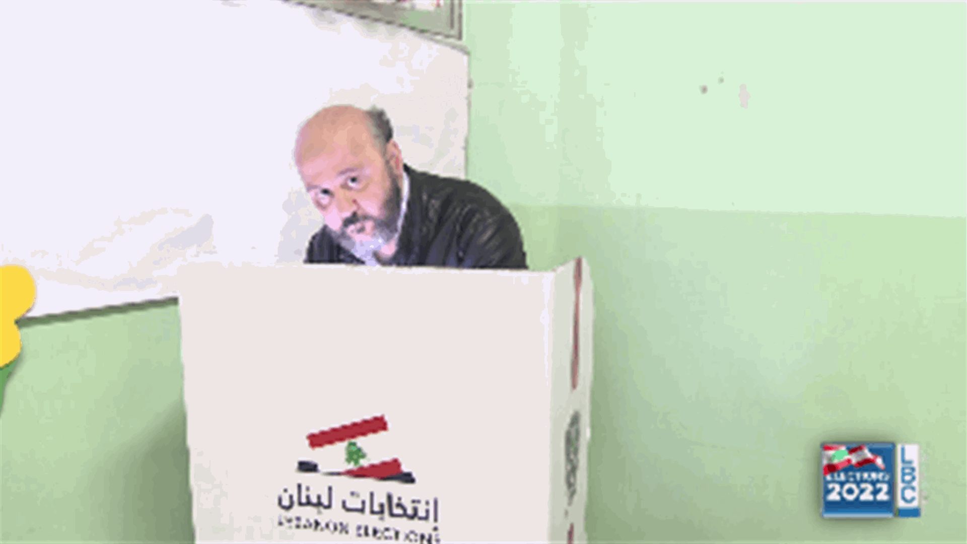 Candidate for the Catholic seat in al-Matn Melhem Riachi casts his vote