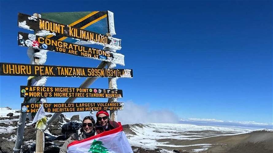 Two Lebanese women raise Lebanon's flag atop Africa's highest mountain