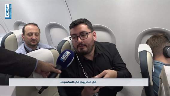 Commemorative pins from LBCI to journalists in honor of the Pope's visit